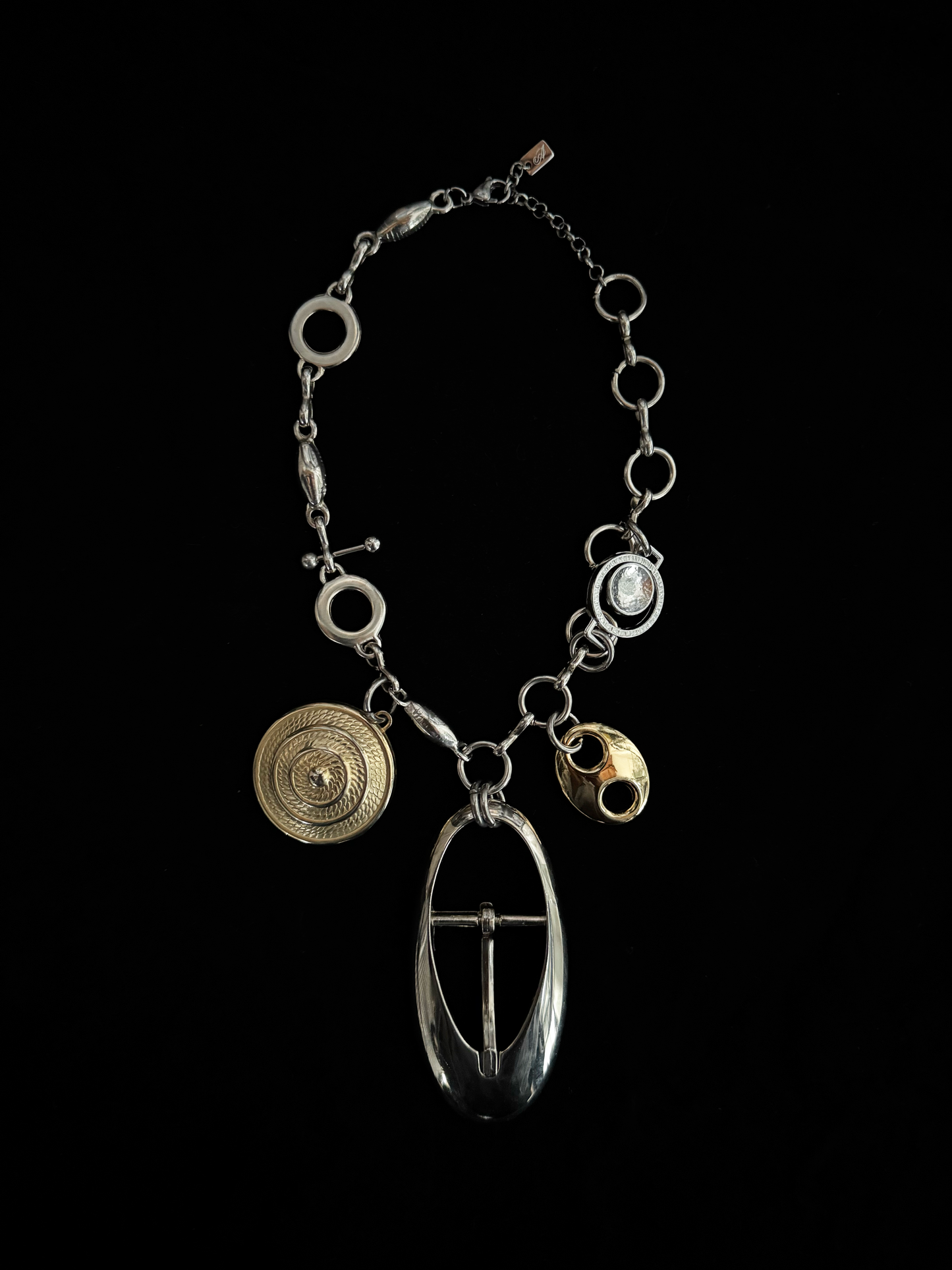 Bold statement necklace by weARCHIVE with upcycled mixed stainless steel charms on a chunky stainless steel chain.