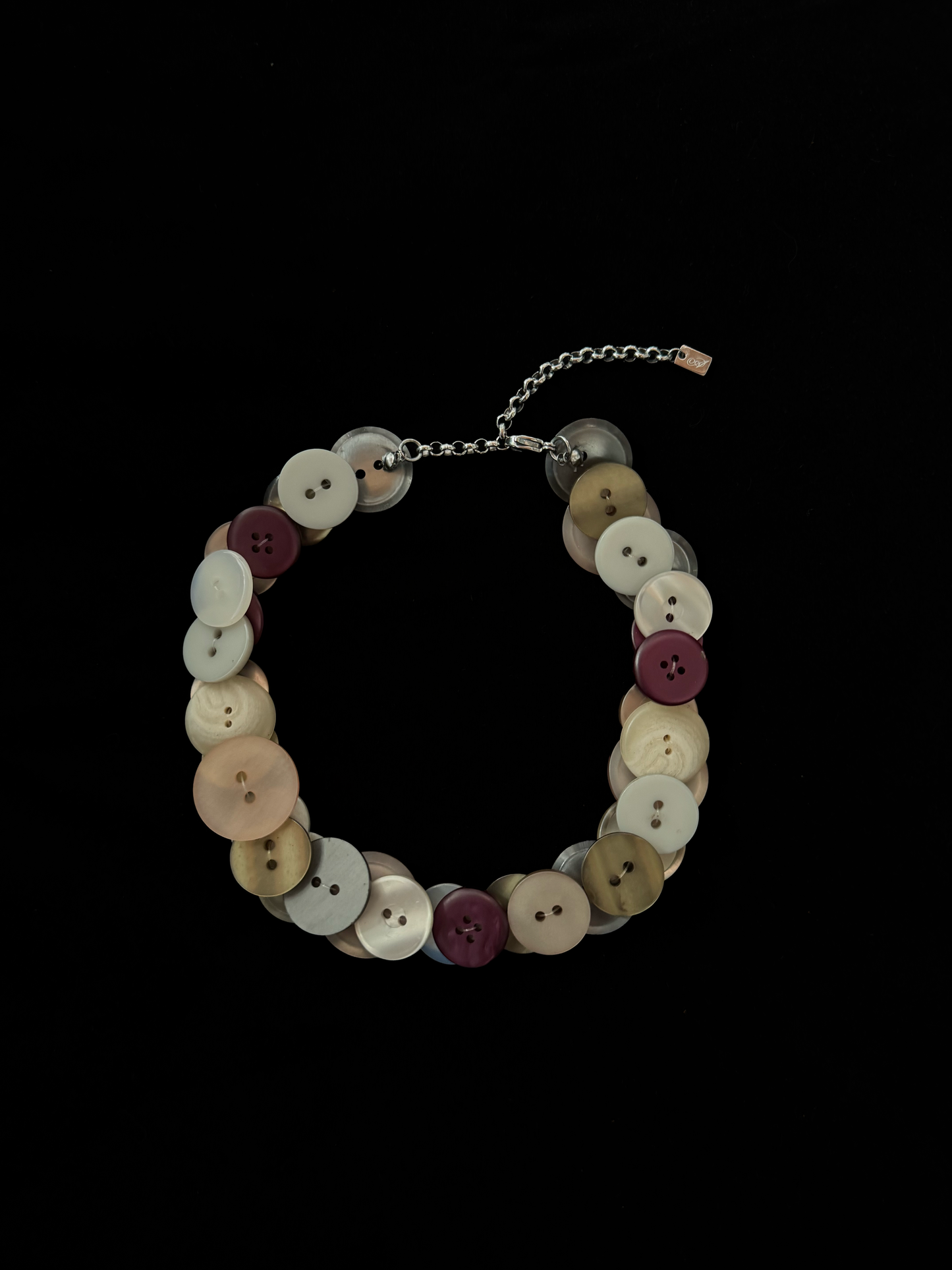 Handmade weARCHIVE choker made of vintage buttons in ivory, peach, burgundy, and metallic tones. Upcycled design with a soft, nostalgic palette.