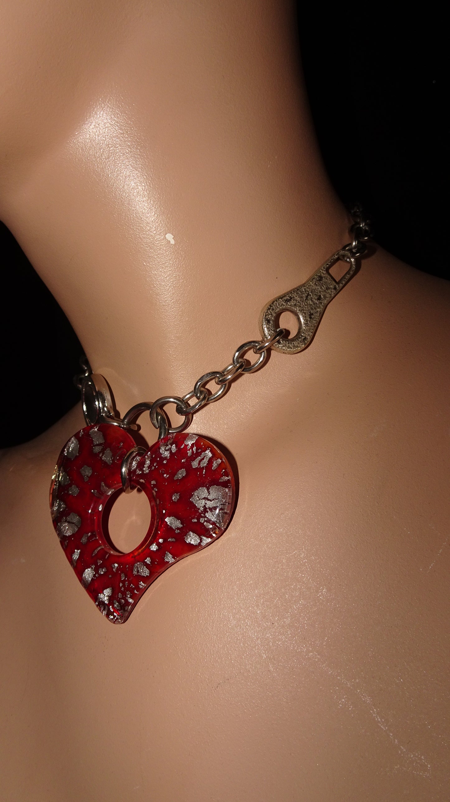 Upcycled stainless steel choker by weARCHIVE with a bold red glass heart pendant, industrial hardware links.