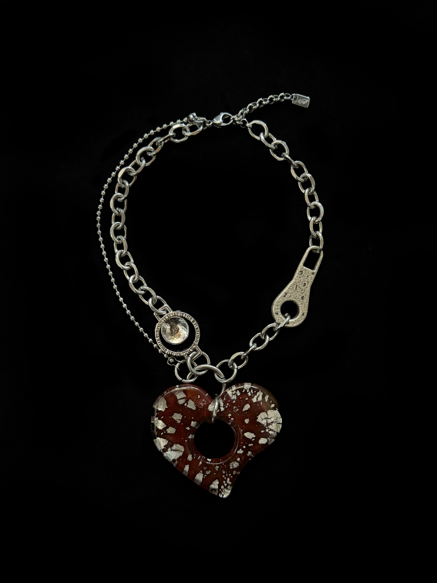 Upcycled stainless steel choker by weARCHIVE with a bold red glass heart pendant, industrial hardware links.