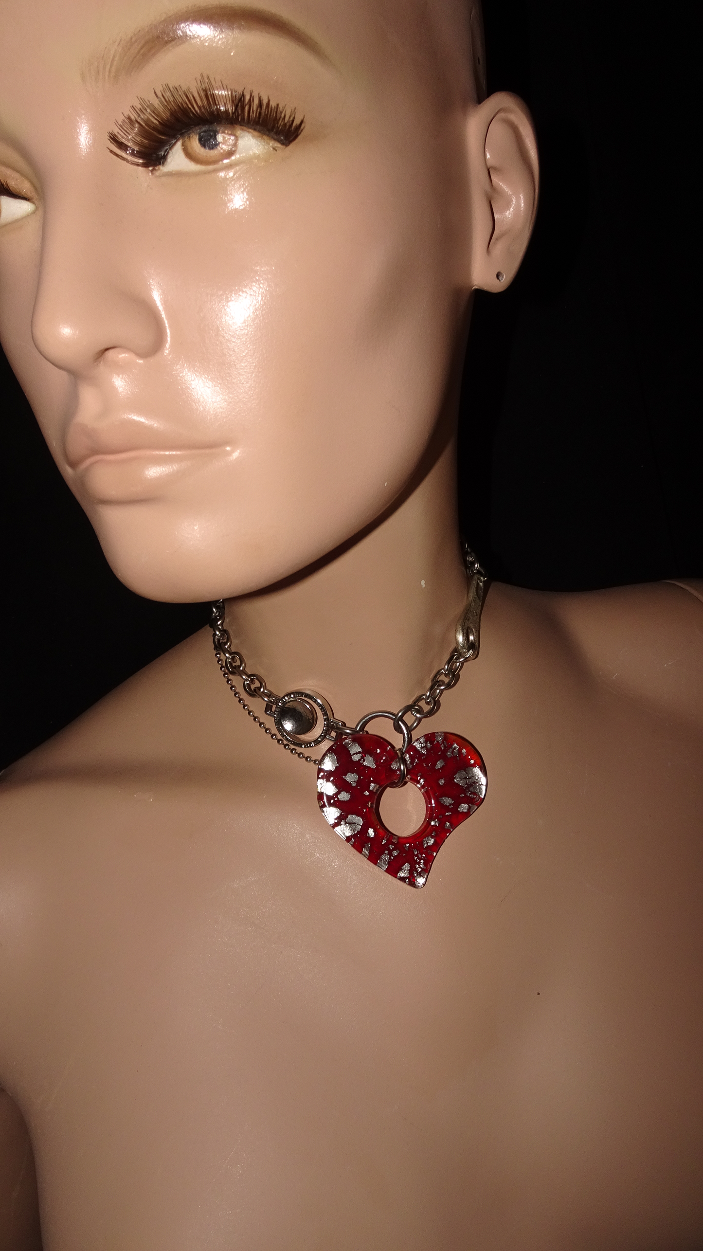 Upcycled stainless steel choker by weARCHIVE with a bold red glass heart pendant, industrial hardware links.