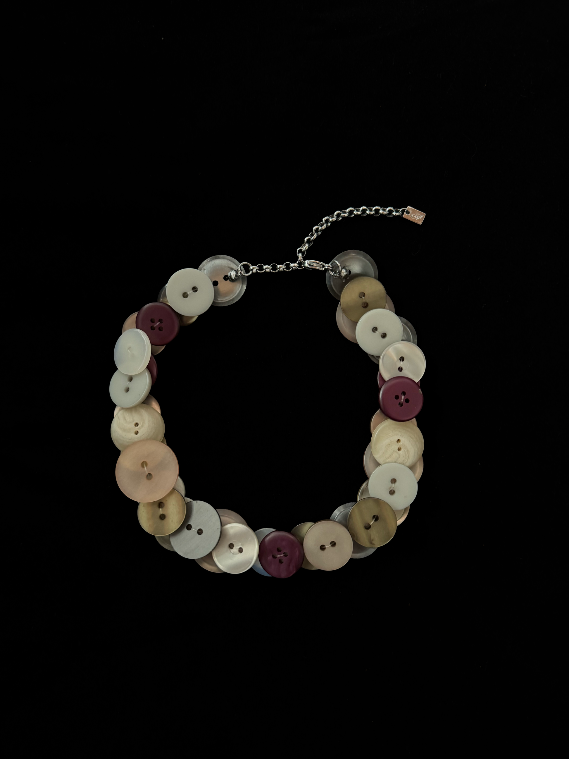Handmade weARCHIVE choker made of vintage buttons in ivory, peach, burgundy, and metallic tones. Upcycled design with a soft, nostalgic palette.

