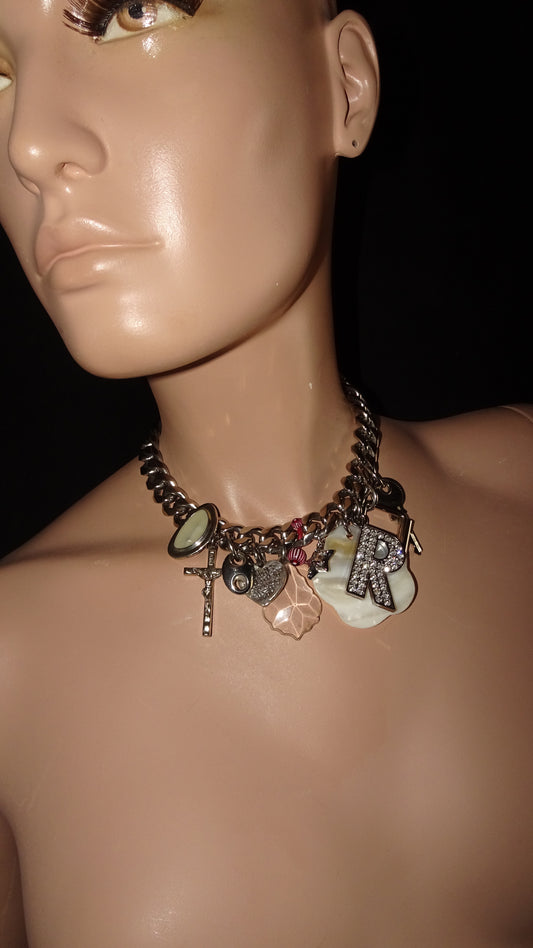 Upcycled charm necklace by weARCHIVE with thick stainless steel chain, featuring vintage charms: key, rhinestone R, cross, shell and more
