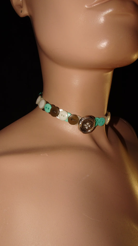 weARCHIVE choker made from vintage turquoise, tan, and ivory buttons, finished with a recycled melted tin button in the centre. Handmade, upcycled and light.
