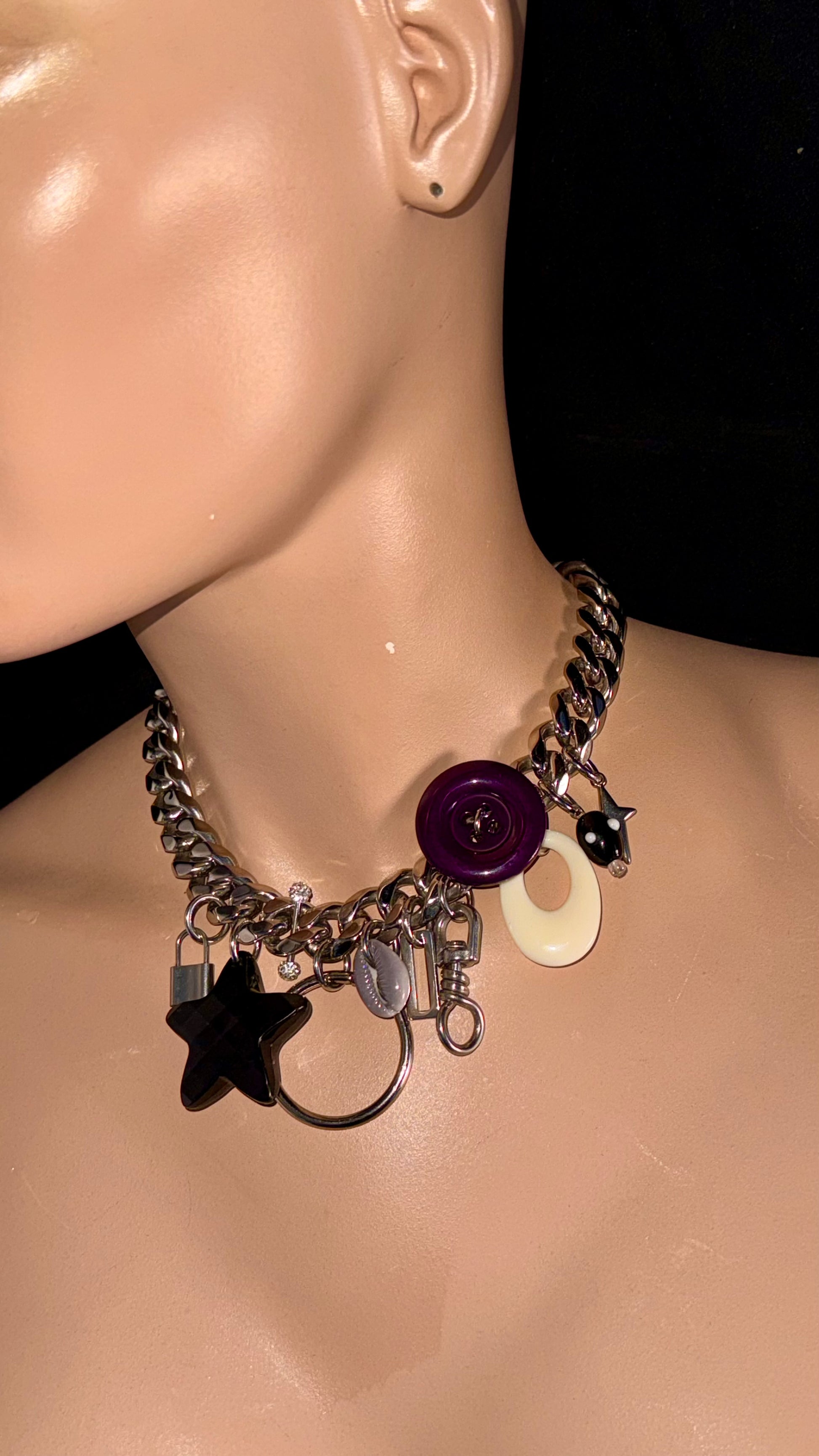 stainless steel charm choker with star charm and vintage button detail
