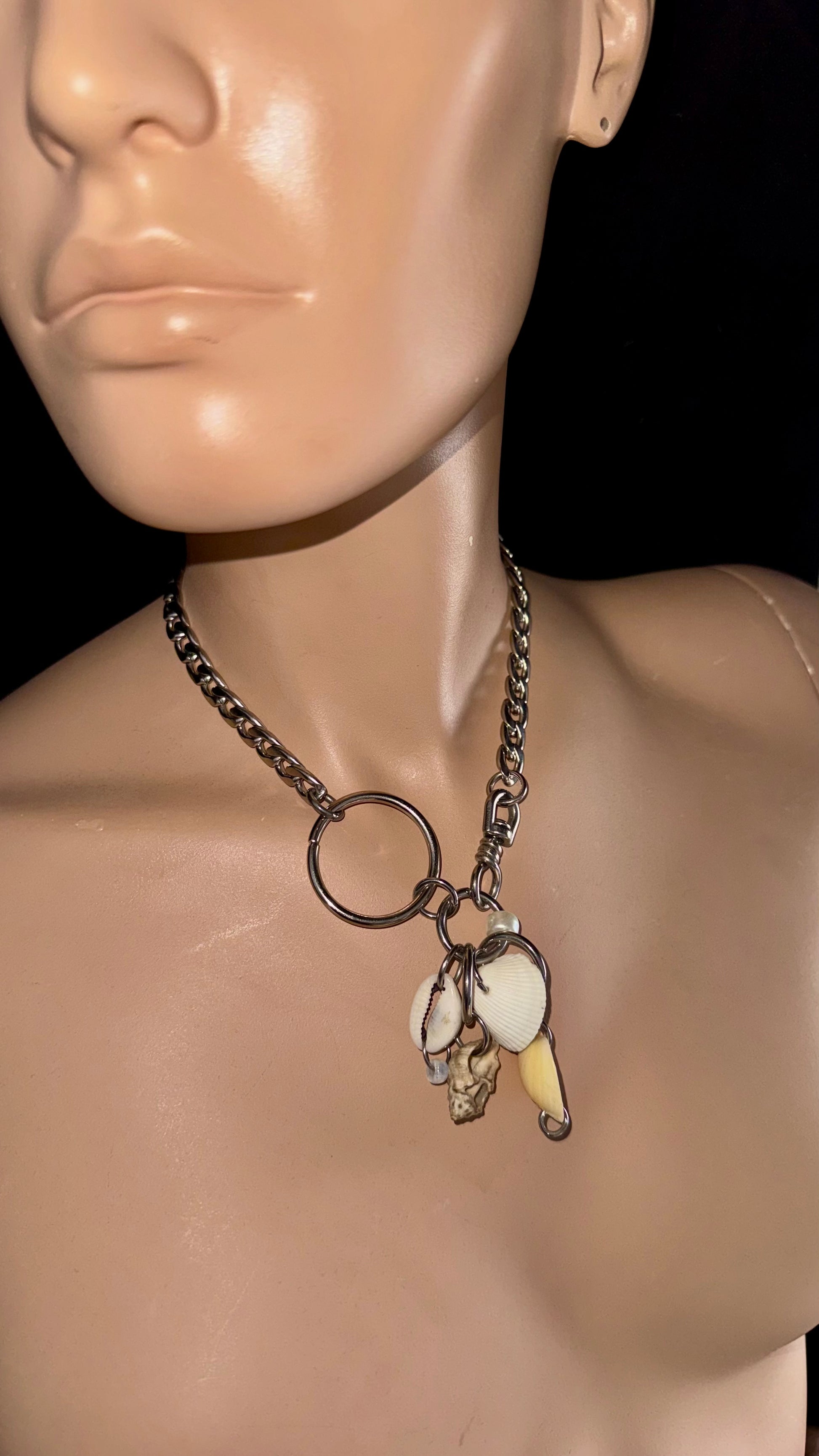 Side view of upcycled shell charm necklace with stainless steel chain